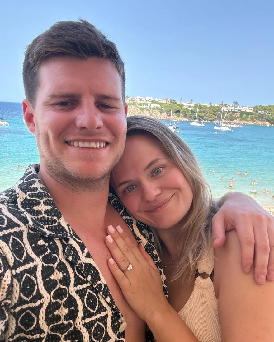 Georgia and Ollie by the sea, Georgia's hand showing her engagement ring
